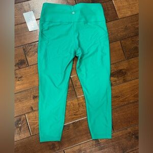 Athleta 7/8 interval stash tight. Beautiful New with tags! Perfect condition